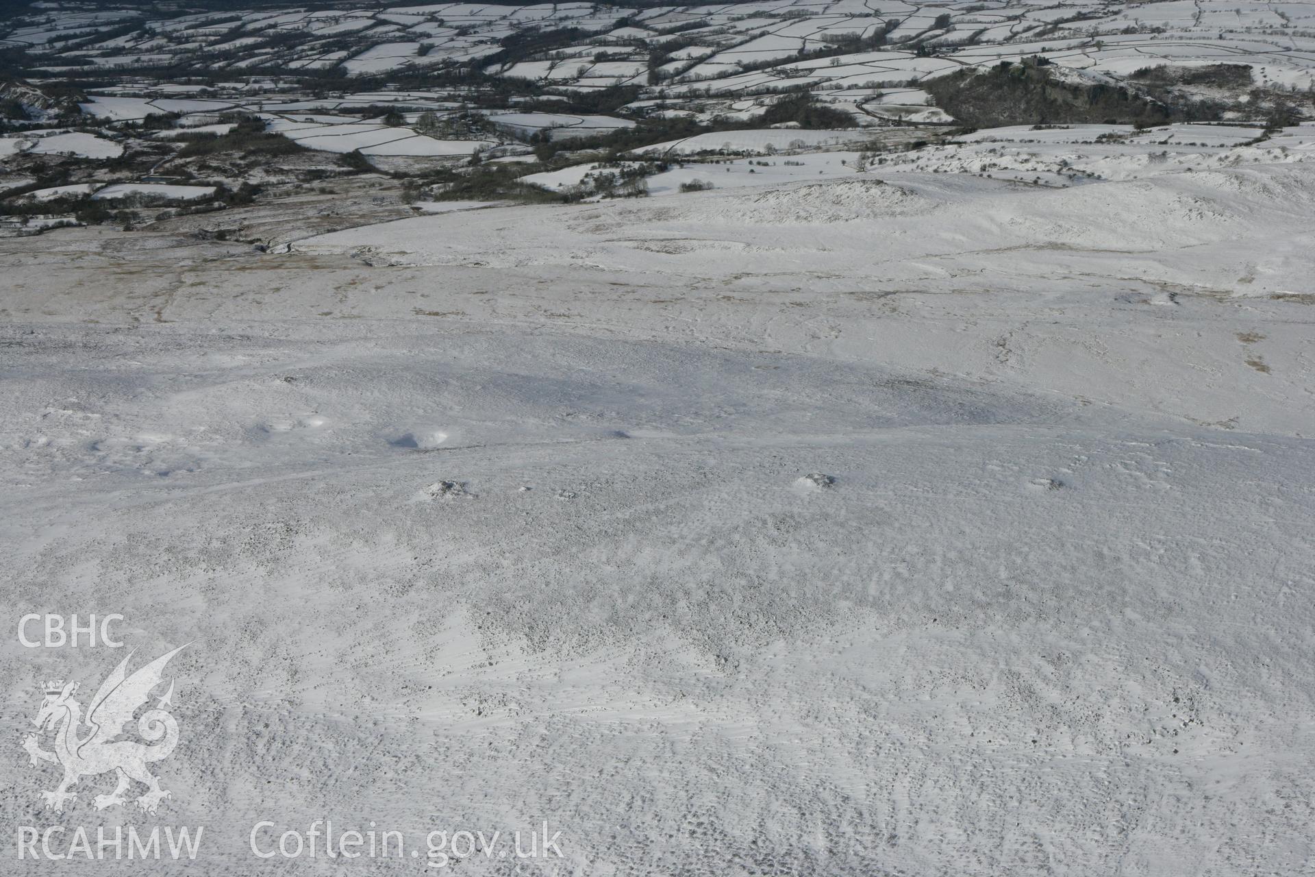 RCAHMW colour oblique photograph of Tair Carn Isaf, cairns. Taken by Toby Driver on 06/02/2009.