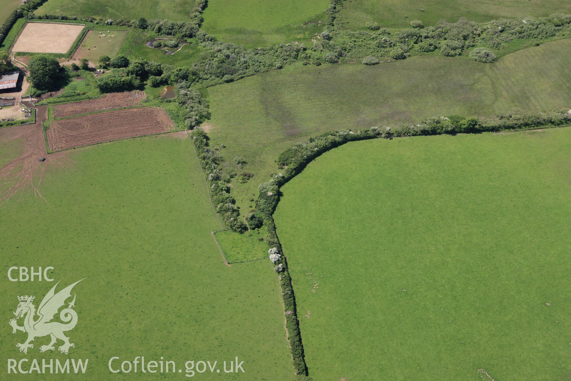 RCAHMW colour oblique aerial photograph of a burnt mound 240m northeast  of Highway Park. Taken on 01 June 2009 by Toby Driver