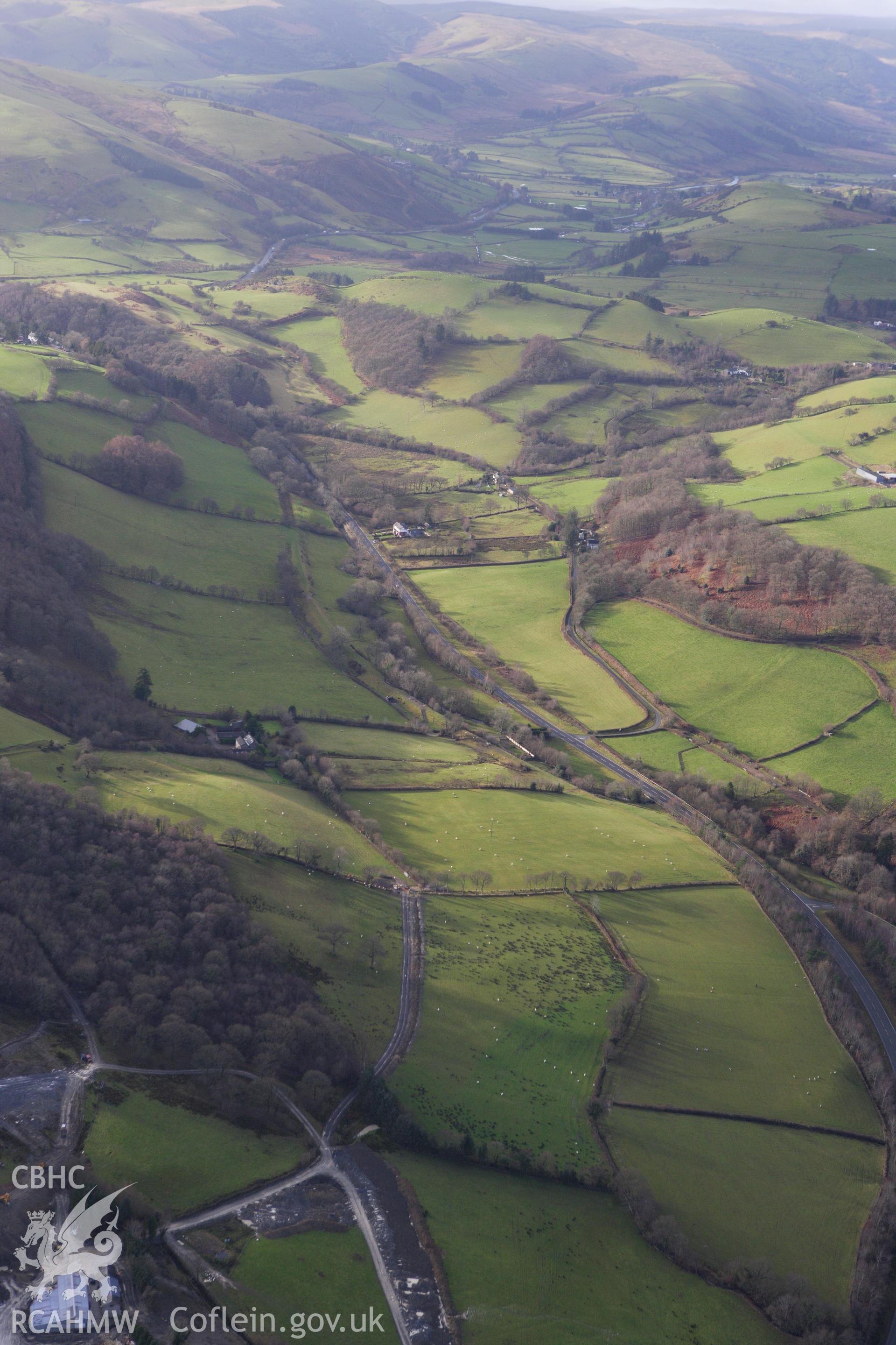 RCAHMW colour oblique aerial photograph of a section of the dismantled Manchester and Milford Railway between Llangurig and Llanidloes looking south-west. Taken on 10 December 2009 by Toby Driver