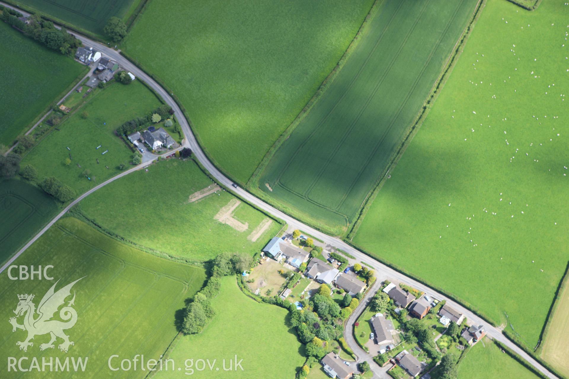 RCAHMW colour oblique aerial photograph of Walton Green Cursus showing trenches excavated by the Clwyd-Powys Archaeological Trust. Taken on 11 June 2009 by Toby Driver