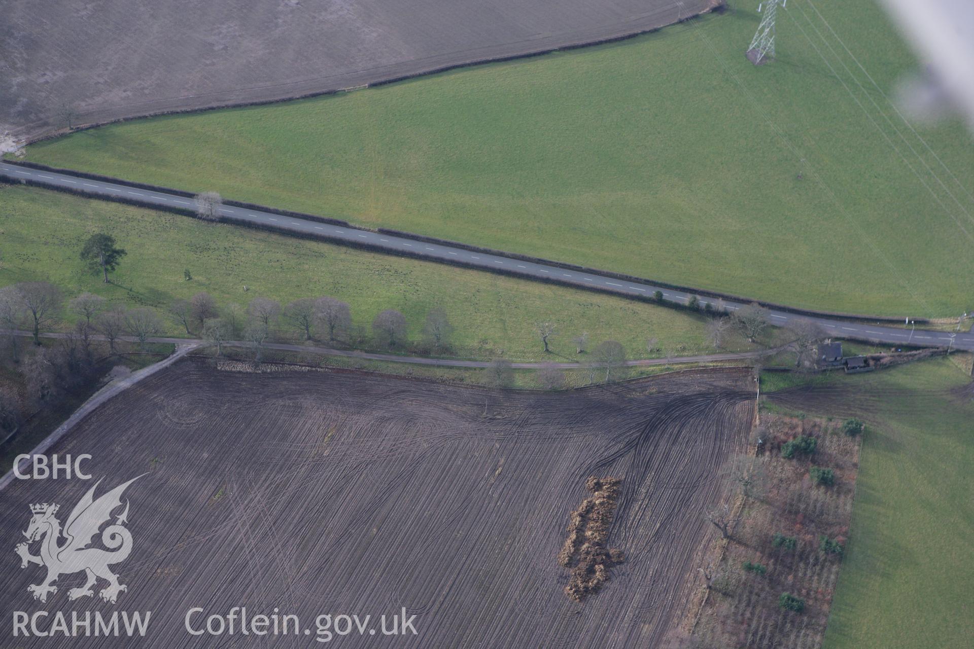 RCAHMW colour oblique photograph of Pentrehobyn round barrow. Taken by Toby Driver on 21/01/2009.