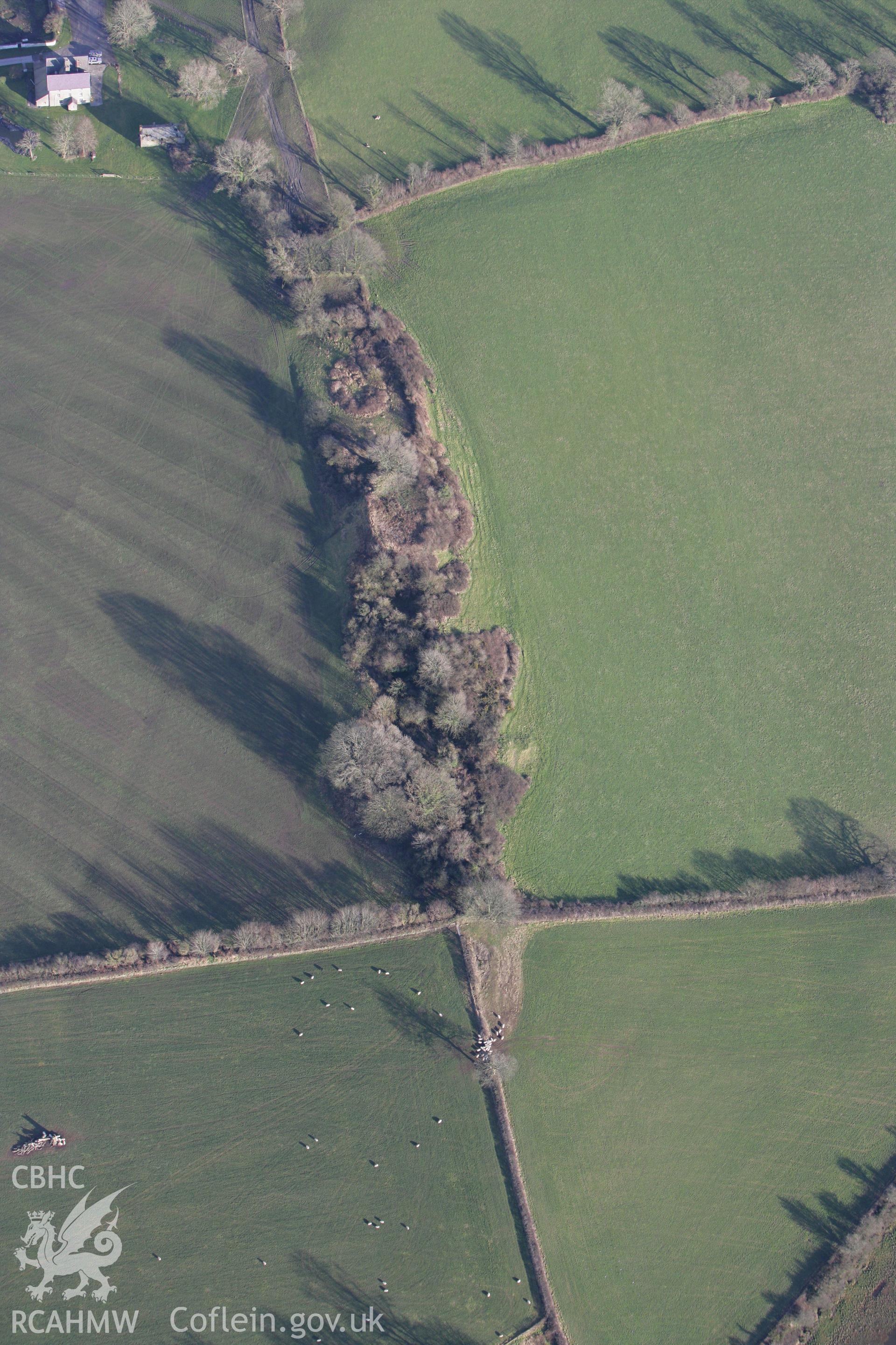 RCAHMW colour oblique photograph of Castell Aber Taf, motte and bailey. Taken by Toby Driver on 11/02/2009.