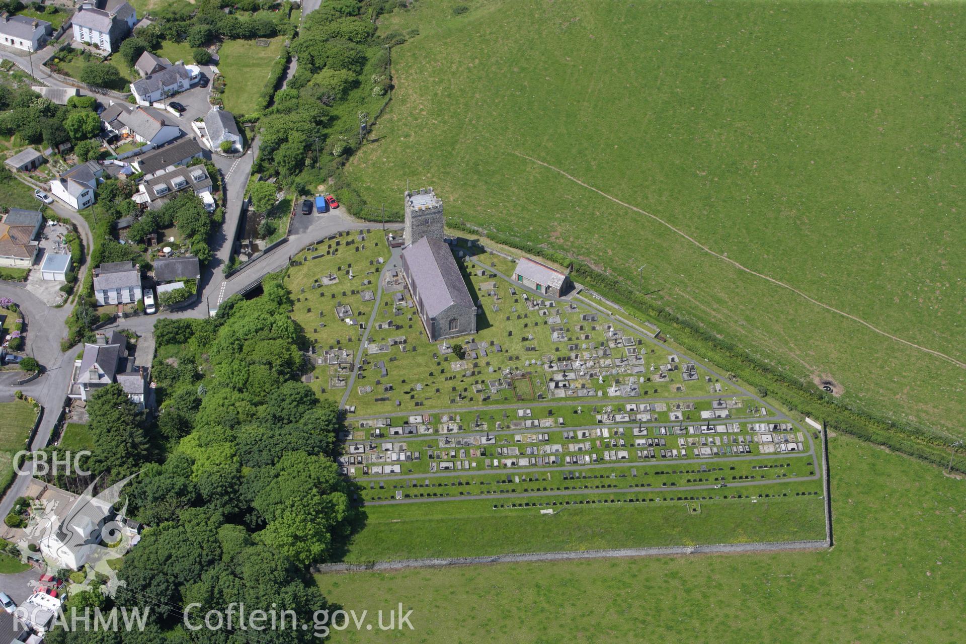 RCAHMW colour oblique aerial photograph of St Ffraid's or St Bride's Church, Llansantffraid. Taken on 02 June 2009 by Toby Driver