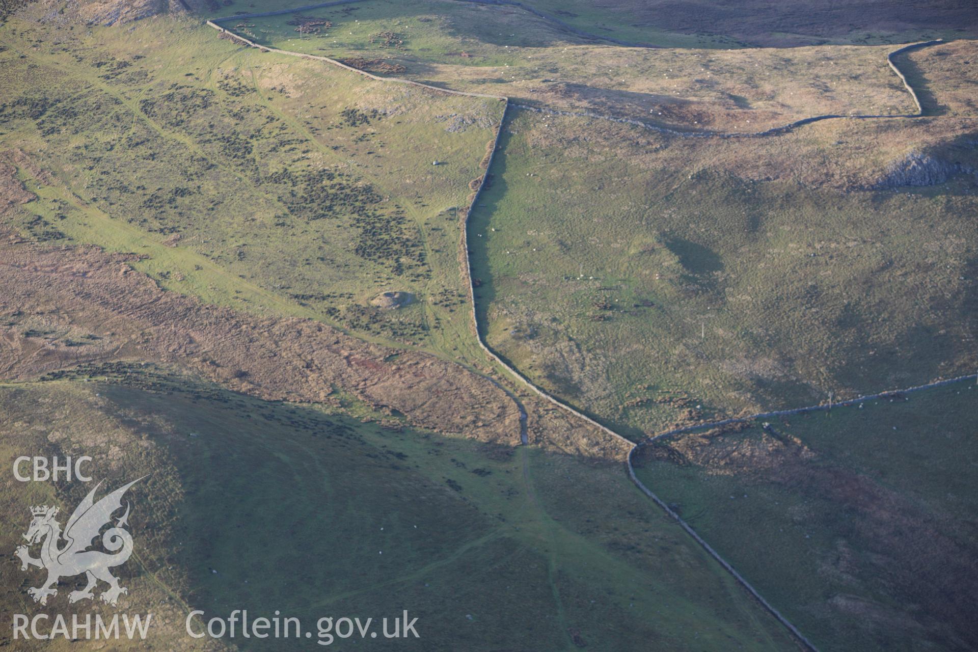 RCAHMW colour oblique aerial photograph of a cairn on Cefn Coch. Taken on 10 December 2009 by Toby Driver