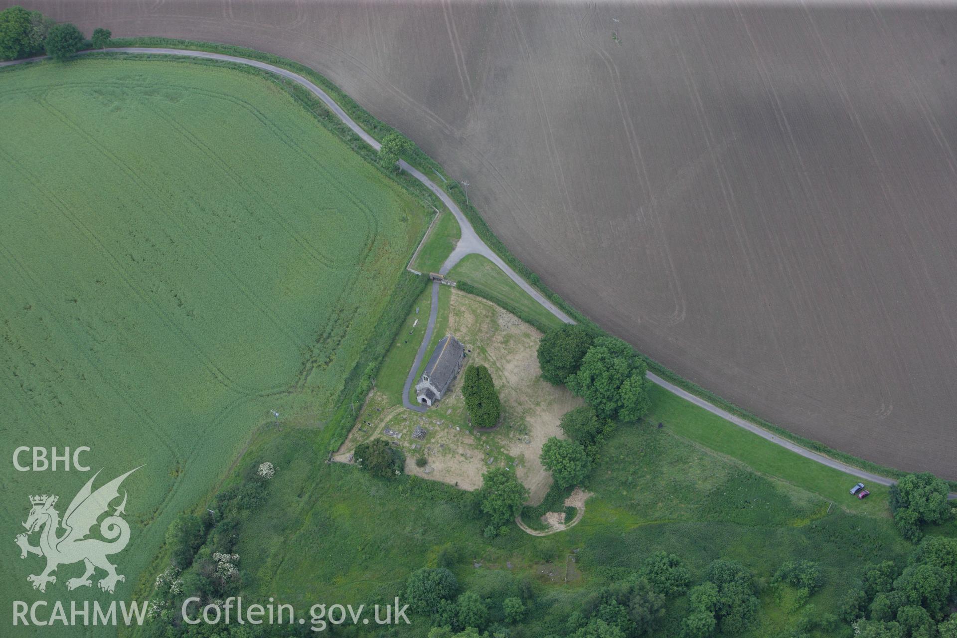 RCAHMW colour oblique aerial photograph of St David's Churchyard Cross, Trostre. Taken on 11 June 2009 by Toby Driver