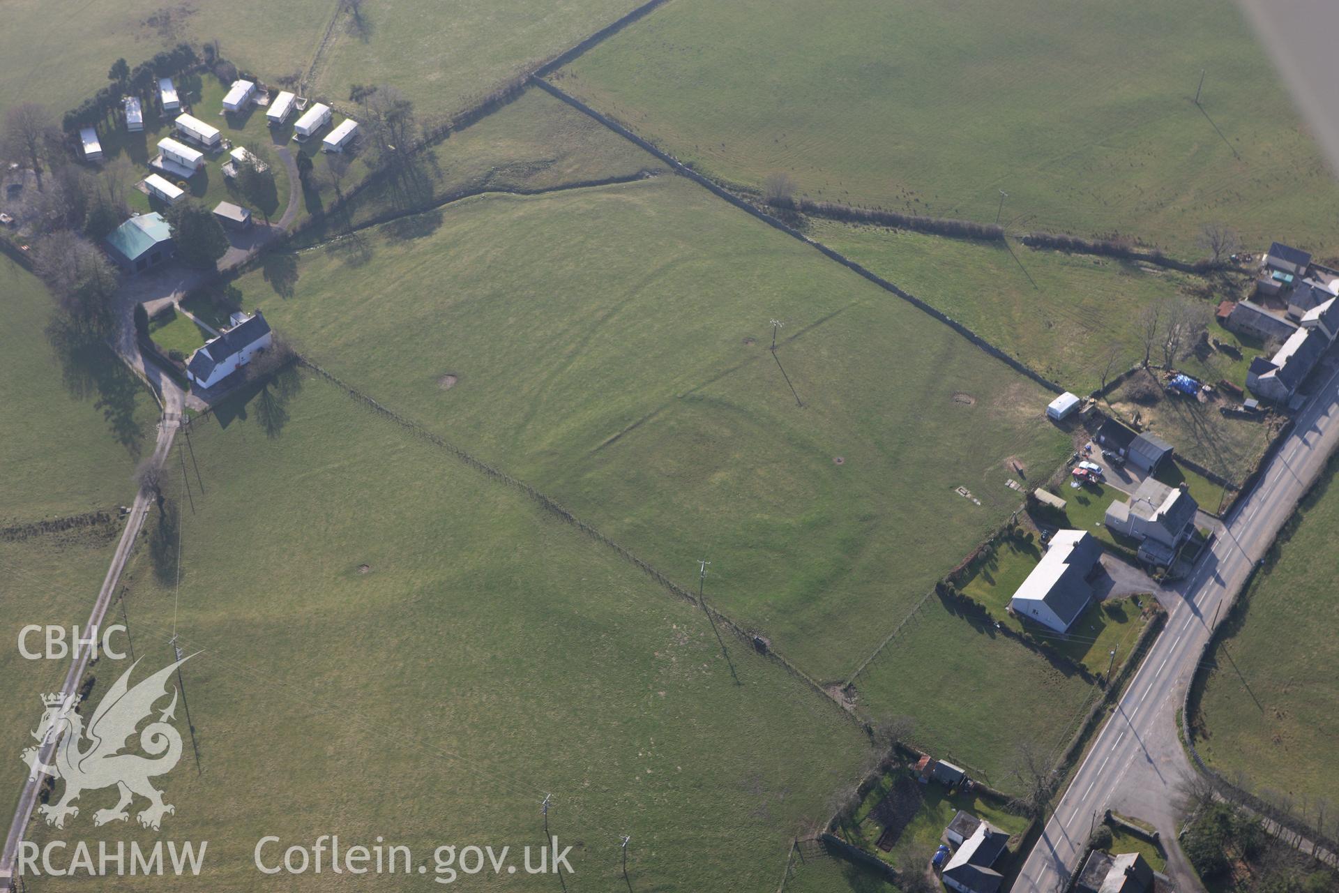 RCAHMW colour oblique photograph of Bryn Teg enclosed settlement. Taken by Toby Driver on 18/03/2009.