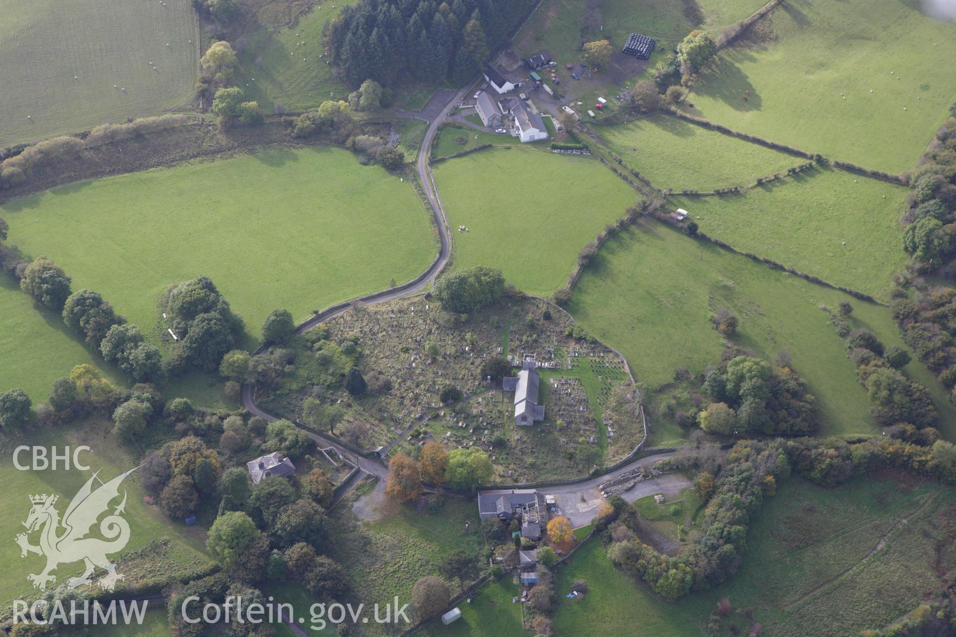 RCAHMW colour oblique aerial photograph of St Cynog's Church. Taken on 14 October 2009 by Toby Driver