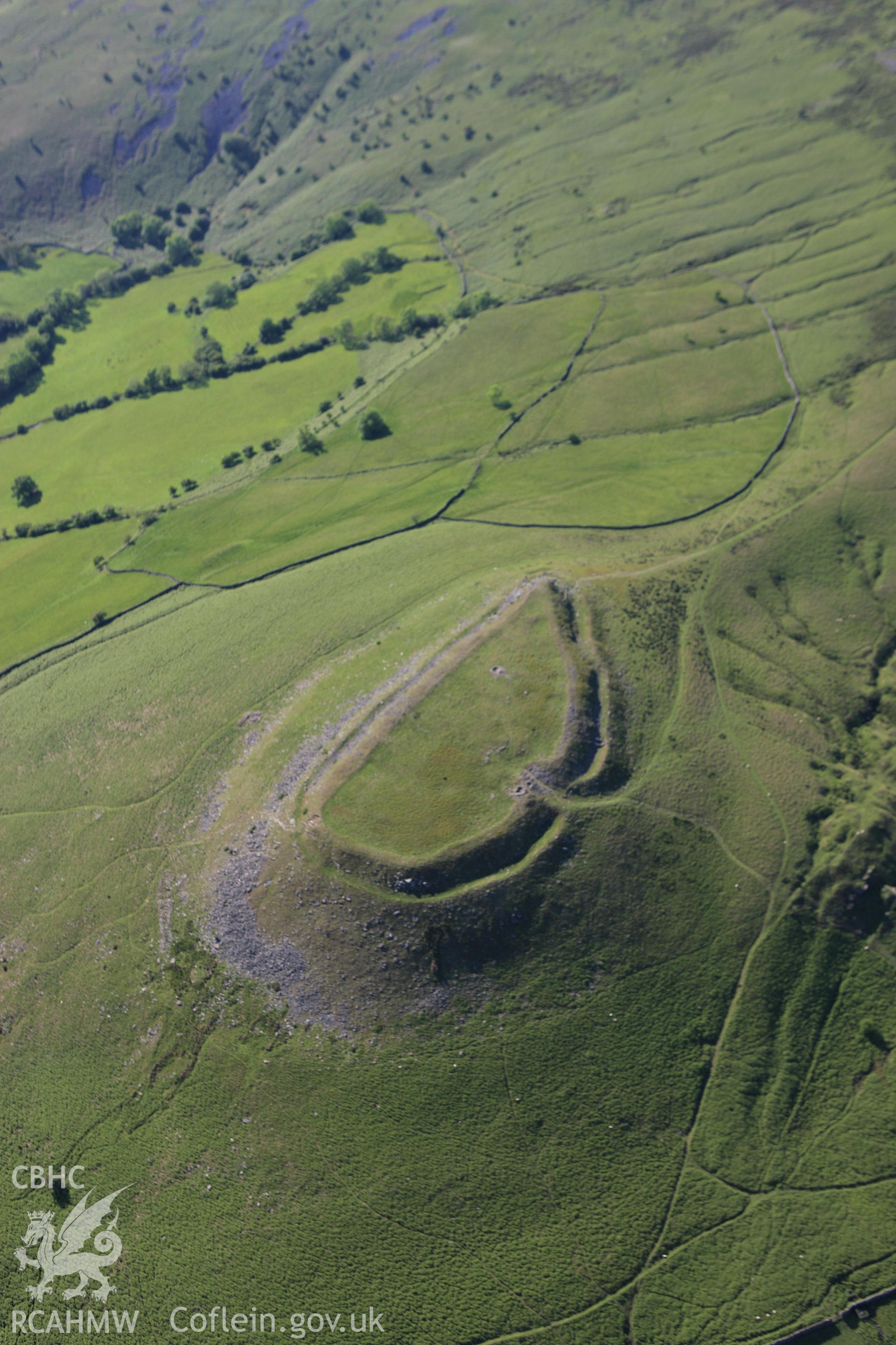 RCAHMW colour oblique aerial photograph of Crug Hywel Camp. Taken on 11 June 2009 by Toby Driver