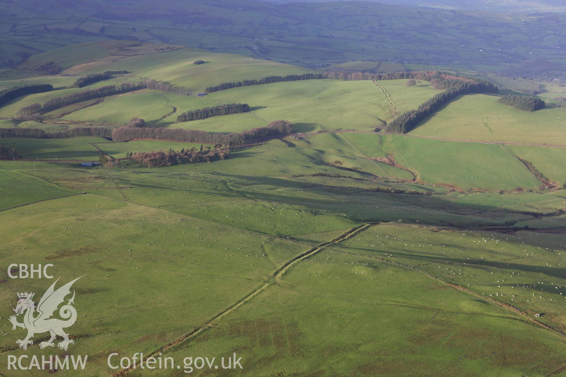 RCAHMW colour oblique aerial photograph of Two Tumps Dyke II and nearby barrows. Taken on 10 December 2009 by Toby Driver