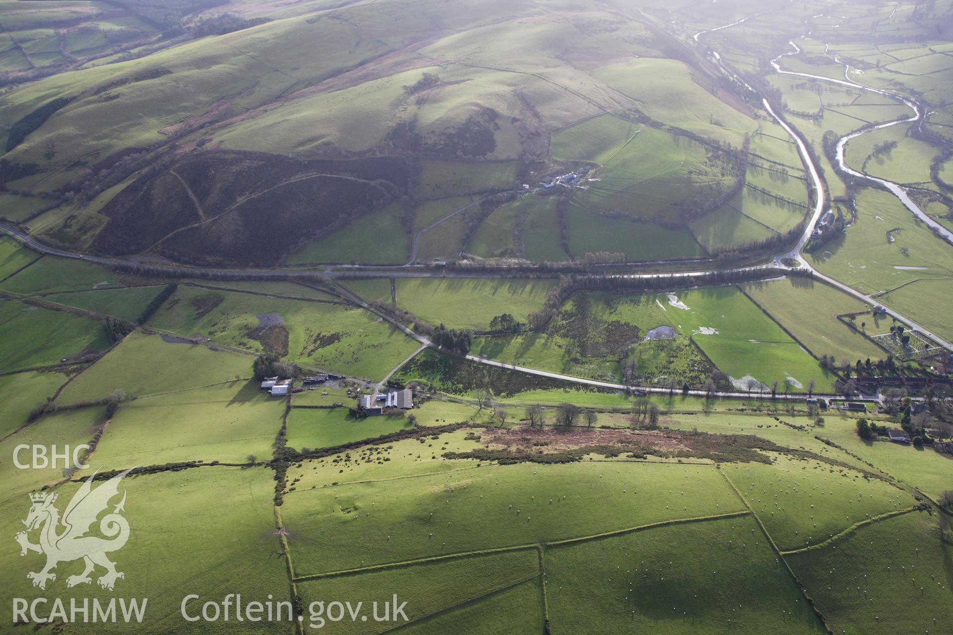 RCAHMW colour oblique aerial photograph of a section of the dismantled Manchester and Milford Railway between Llangurig and Llanidloes approaching Llangurig. Taken on 10 December 2009 by Toby Driver