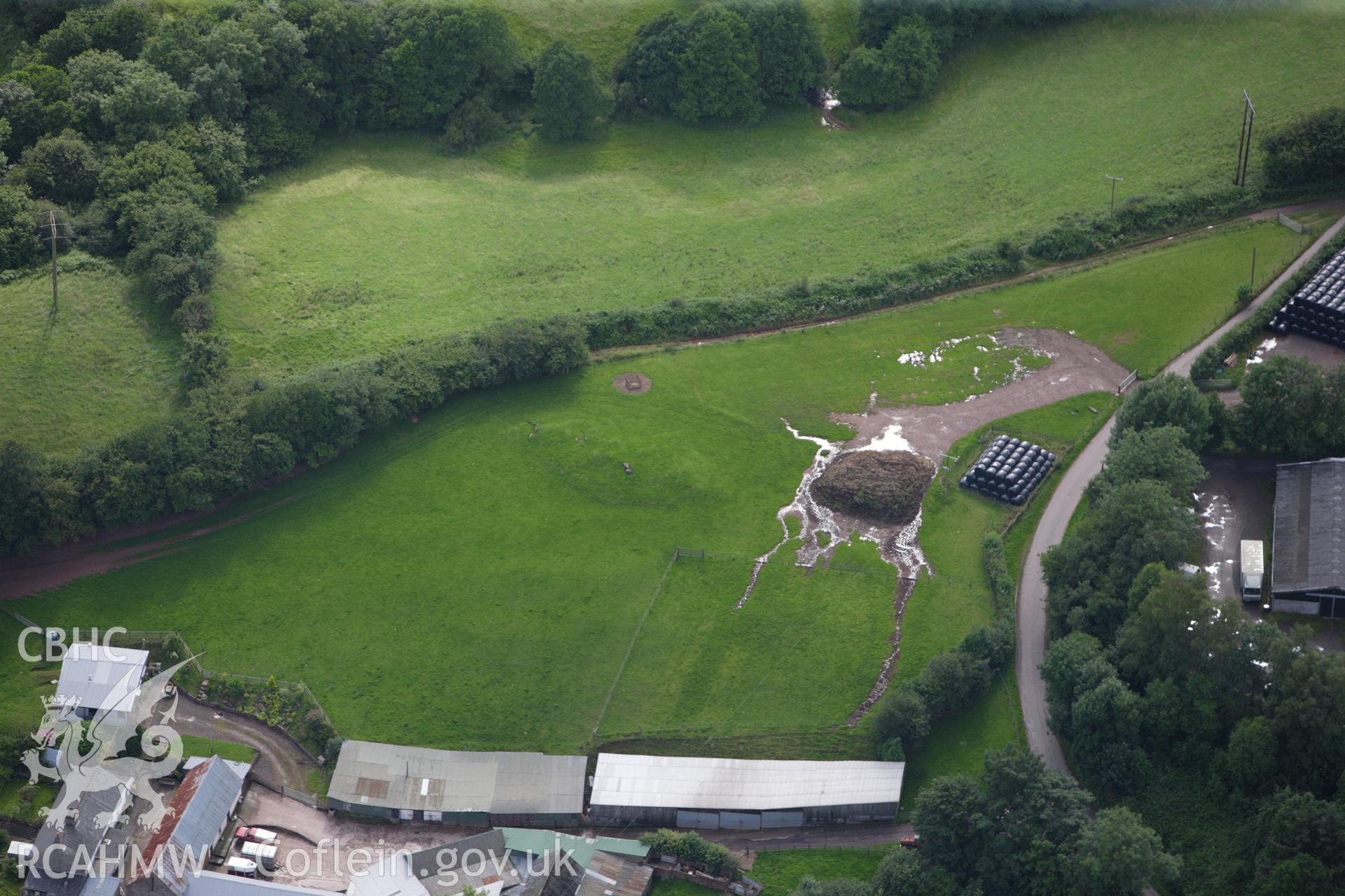 RCAHMW colour oblique aerial photograph of Ty-Isaf Chambered Cairn. Taken on 23 July 2009 by Toby Driver