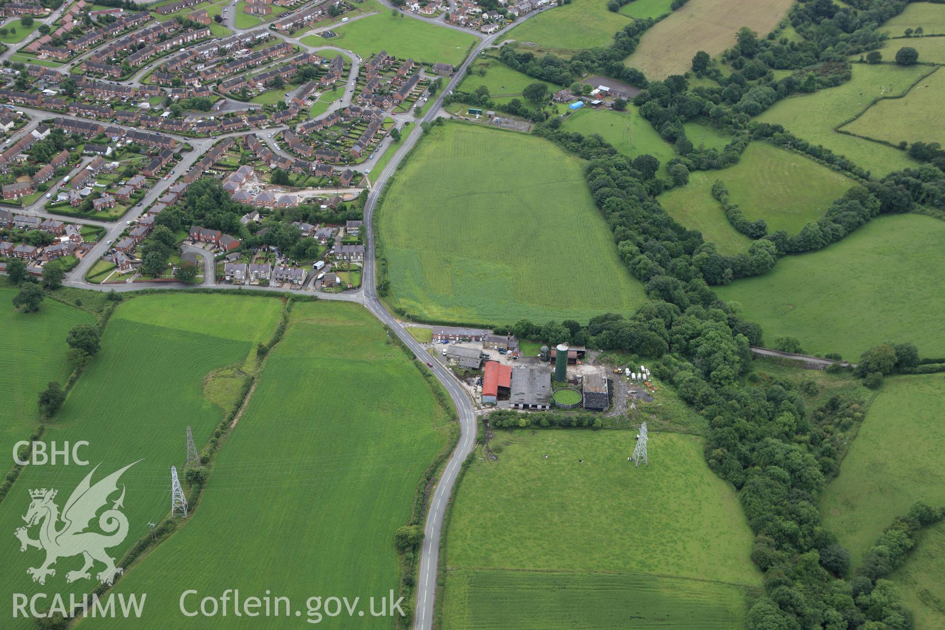 RCAHMW colour oblique aerial photograph of a section of Offa's Dyke south of River Gwenfro. Taken on 08 July 2009 by Toby Driver