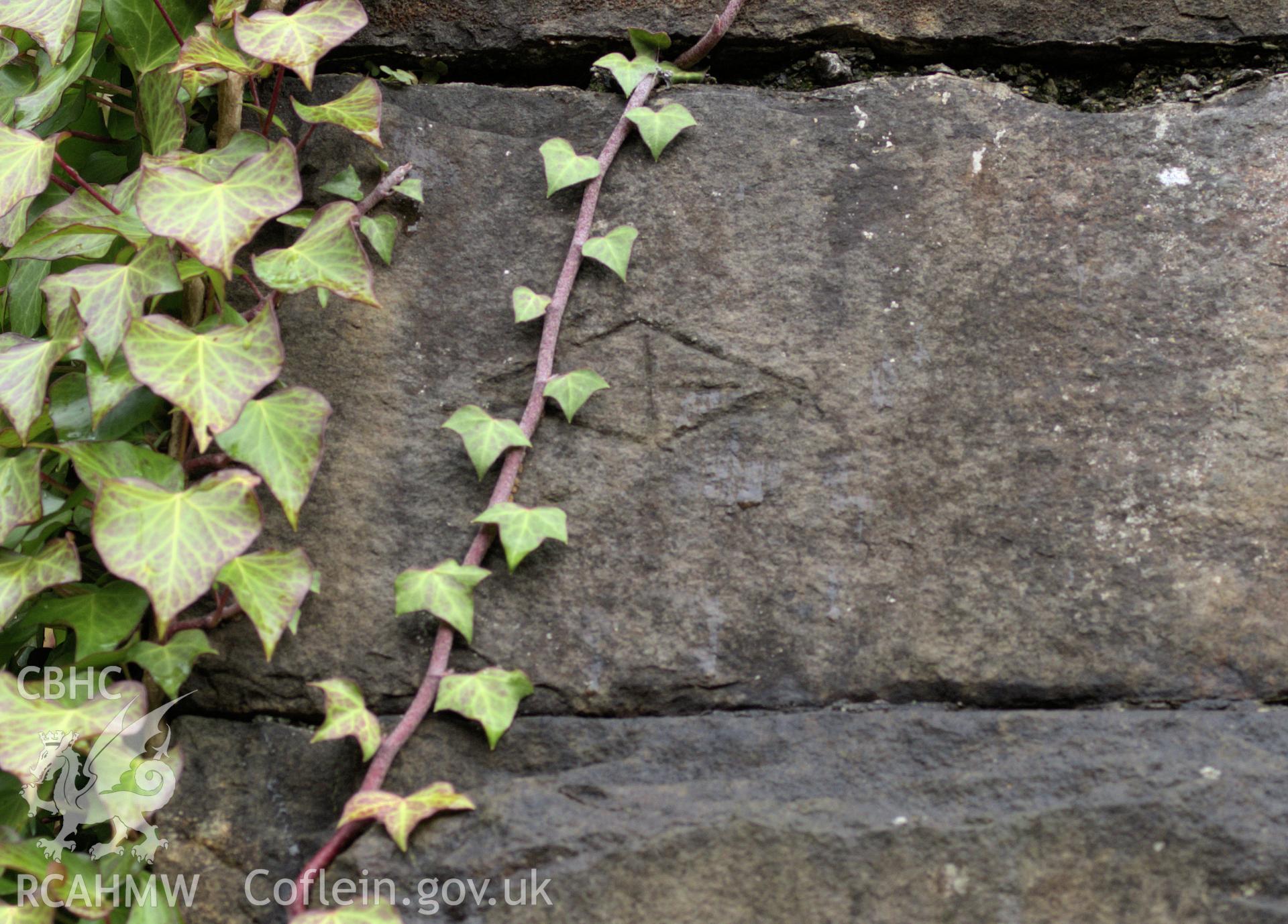 Colour photo showing mason's marks on the stone piers of the viaduct, taken by Mark Evans, January 2017.