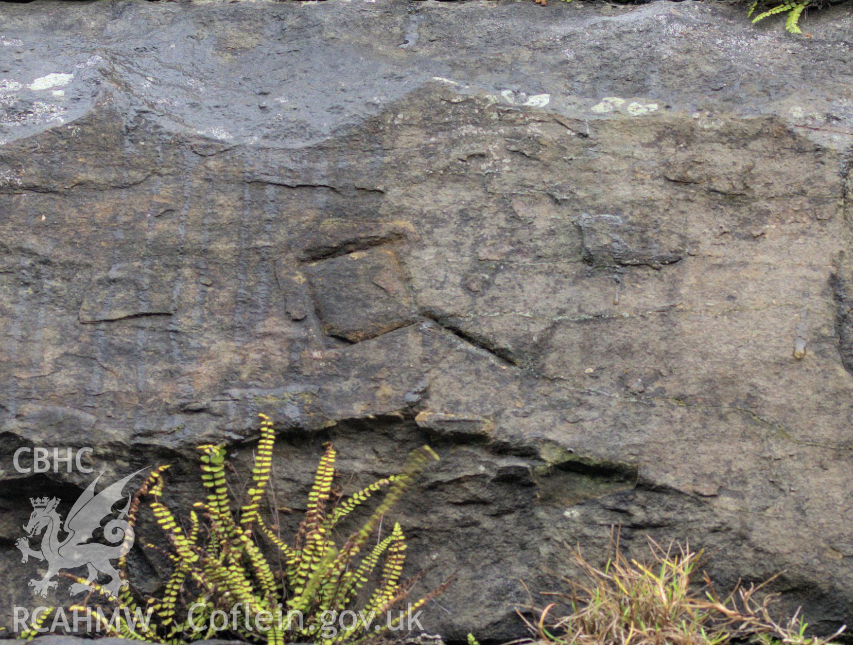 Colour photo showing mason's marks on the stone piers of the viaduct, taken by Mark Evans, January 2017.