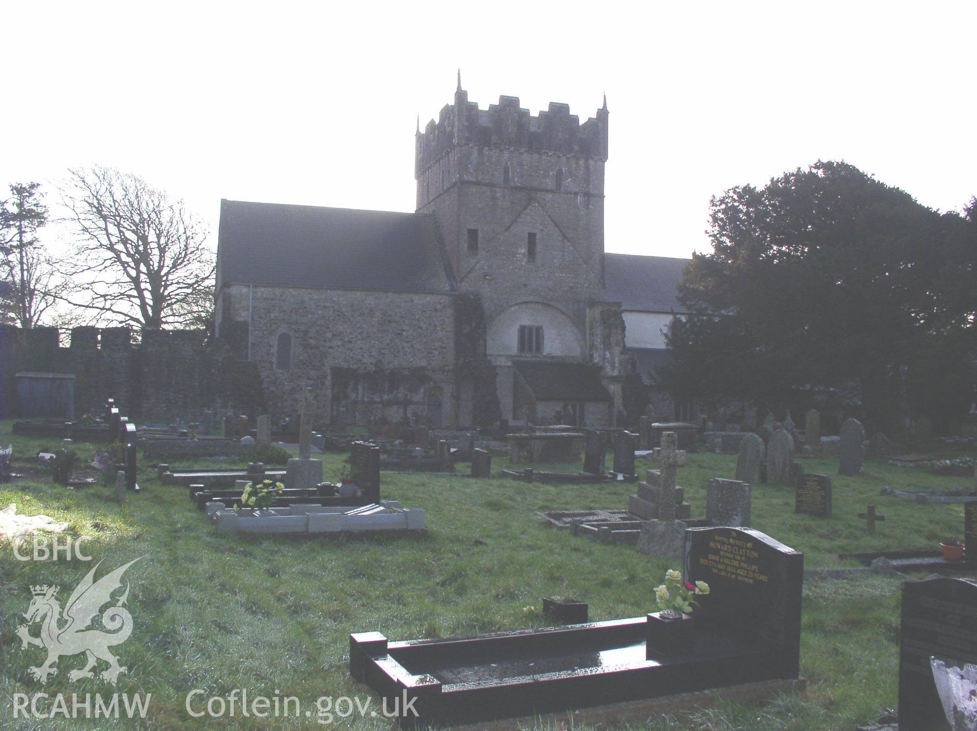 Colour digital photograph showing the exterior and part of the cemetery at St. Michael's Church, Ewenny; Glamorgan.