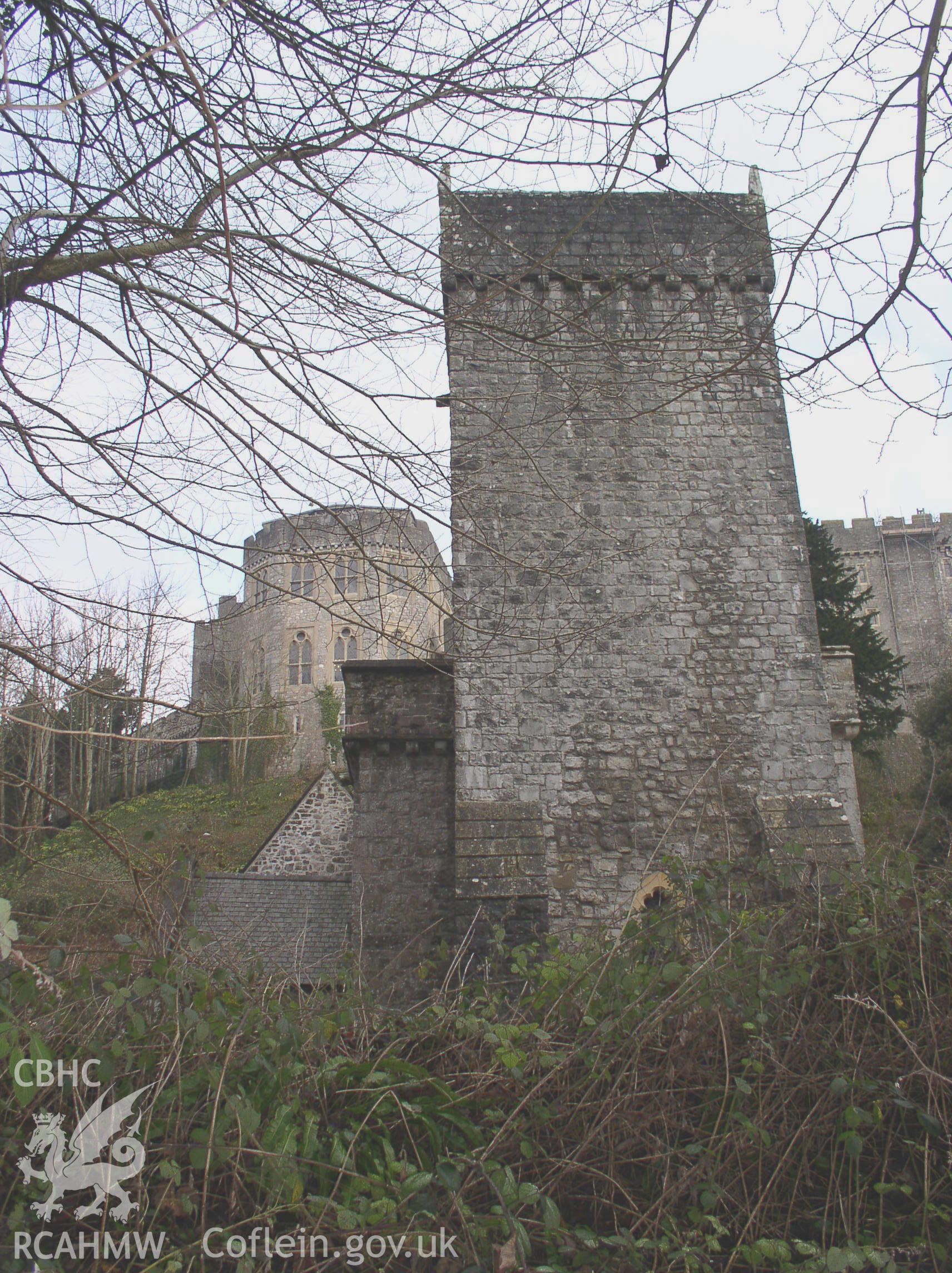 Colour digital photograph showing an elevation view of St Donat's Church, St Donats; Glamorgan. The photograph shows part of St Donats Castle in the background.